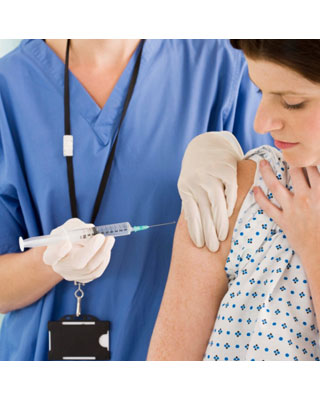 woman getting a shot from a healthcare provider